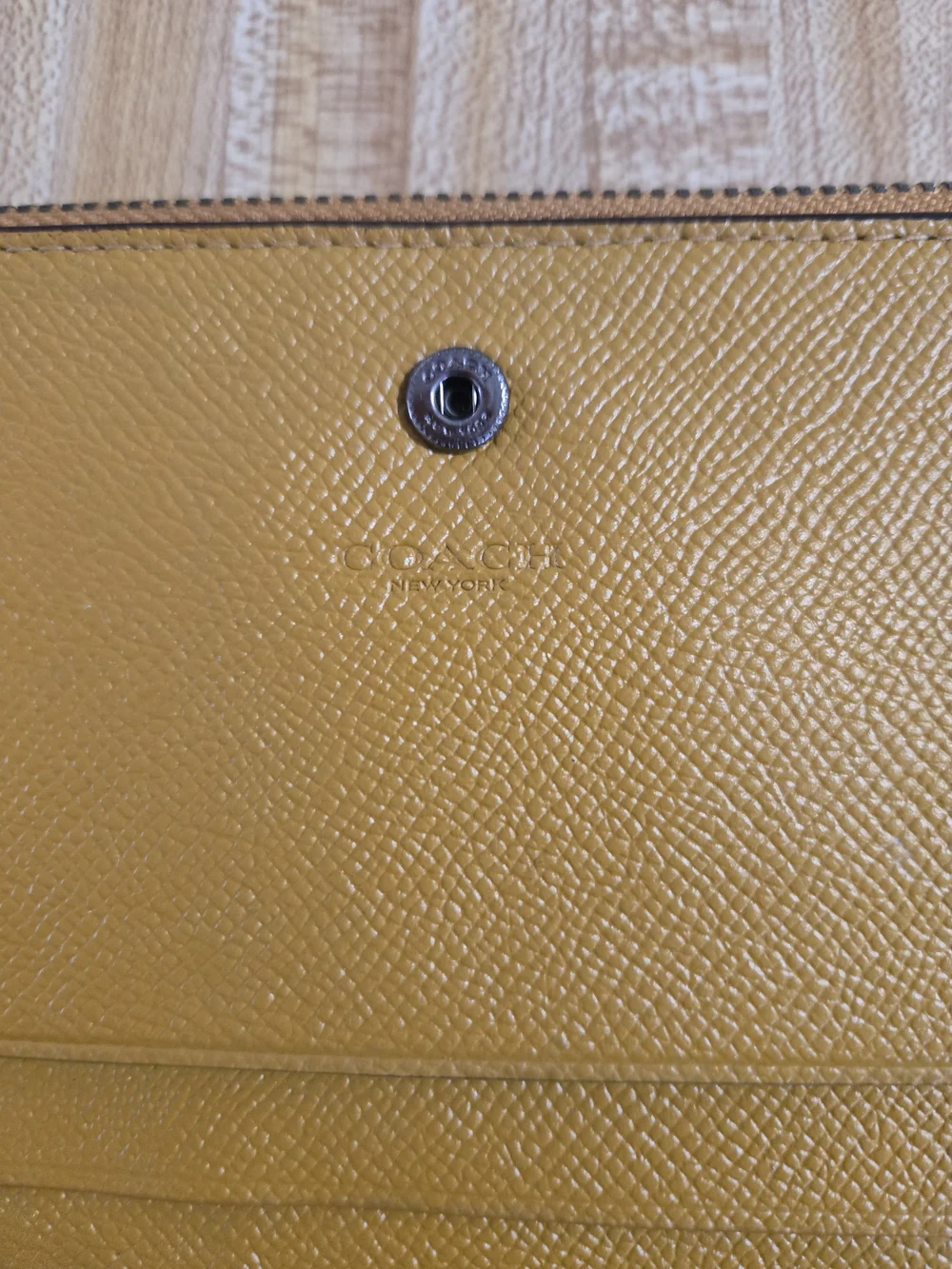 Coach Pebbled Leather Wristlet in Mustard Yellow with Gunmetal Logo